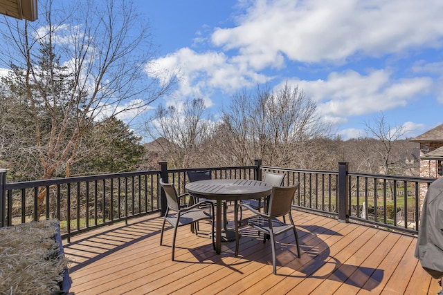 deck with outdoor dining area