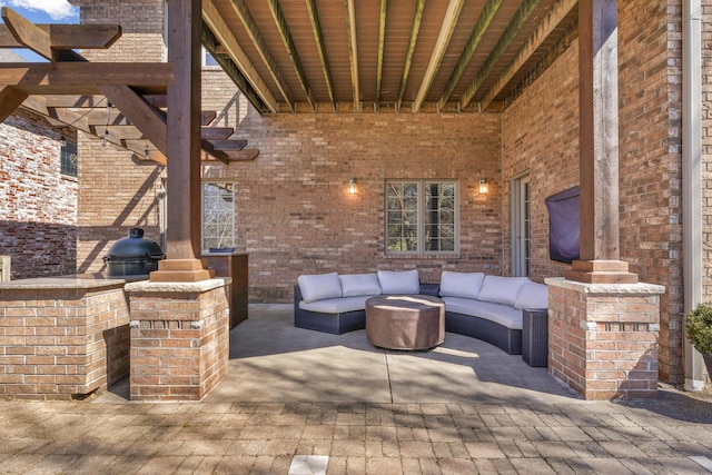 view of patio featuring an outdoor living space and a pergola