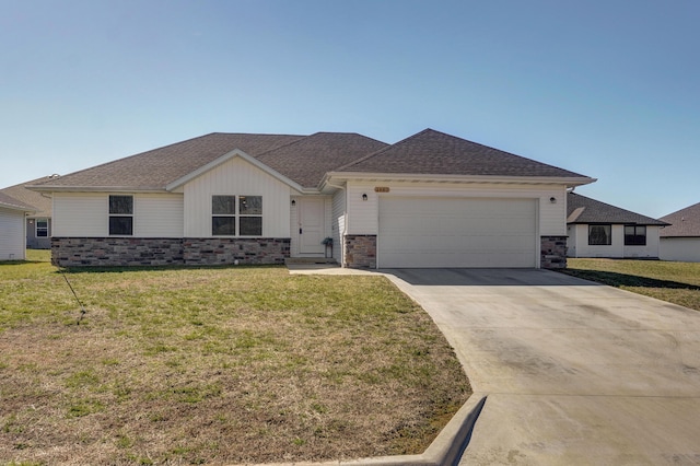 ranch-style home featuring a front lawn, concrete driveway, a garage, and a shingled roof