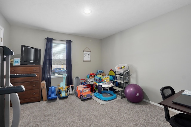 playroom featuring baseboards and carpet