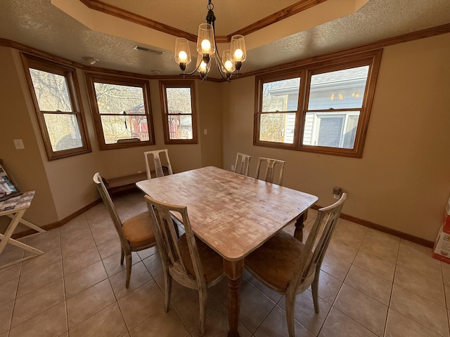 dining room with visible vents, a notable chandelier, a textured ceiling, light tile patterned floors, and baseboards