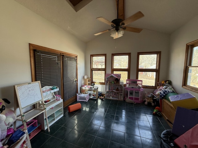 rec room featuring tile patterned flooring, a ceiling fan, and vaulted ceiling