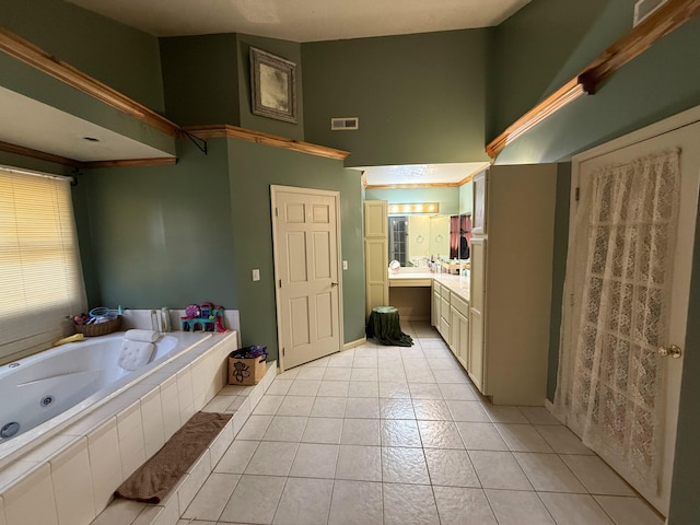 full bathroom with tile patterned floors, visible vents, vanity, and a tub with jets