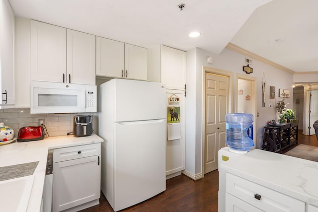 kitchen featuring ornamental molding, tasteful backsplash, dark wood-style floors, white cabinetry, and white appliances