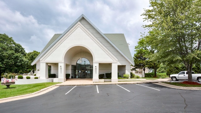 view of property with uncovered parking