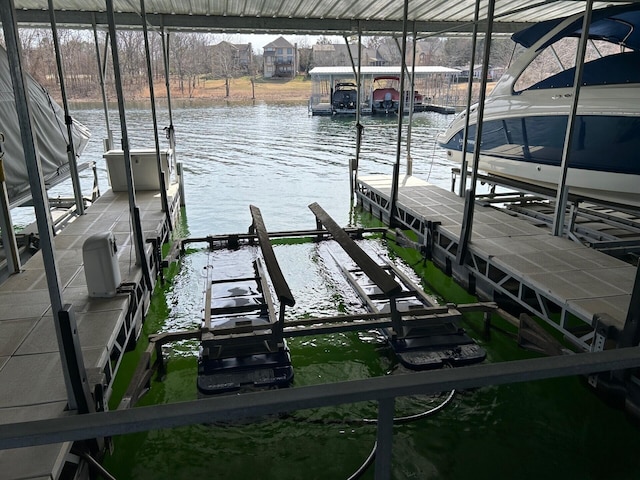 dock area featuring a water view and boat lift