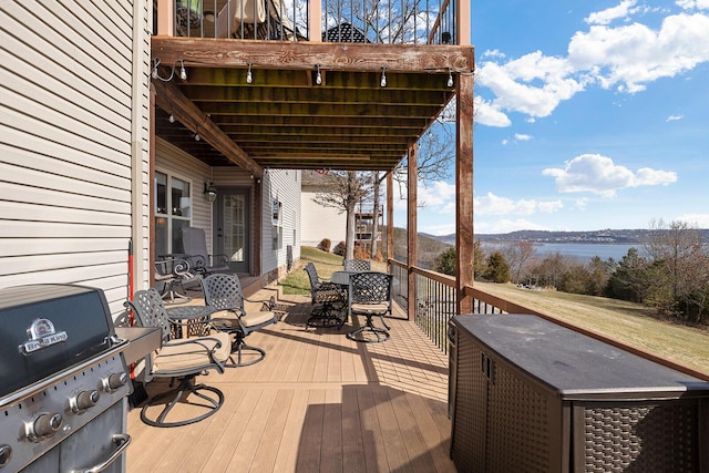 wooden deck featuring area for grilling