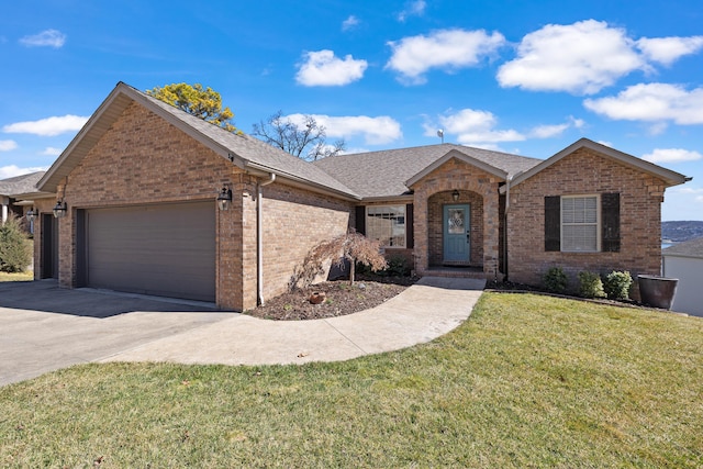 ranch-style home featuring roof with shingles, concrete driveway, a front yard, an attached garage, and brick siding