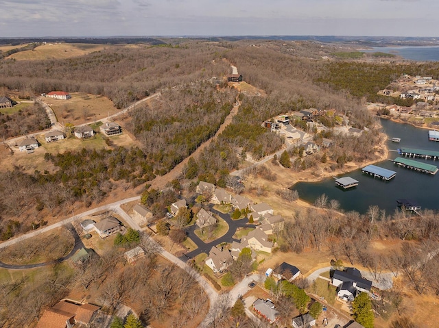 birds eye view of property featuring a water view and a residential view