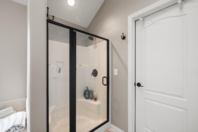 full bathroom featuring a shower stall