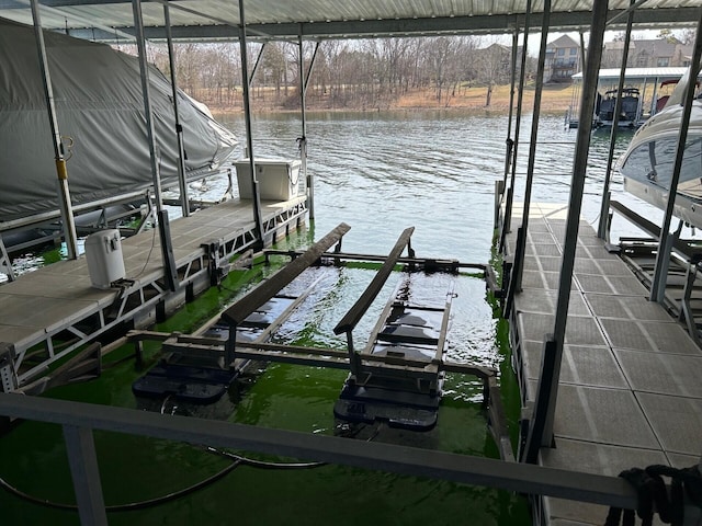 view of dock featuring boat lift and a water view