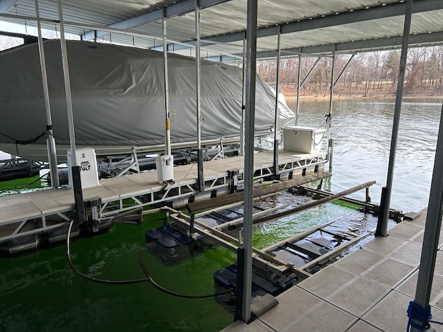 view of dock featuring a water view and boat lift