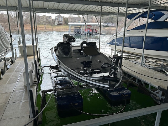 view of dock featuring a water view and boat lift