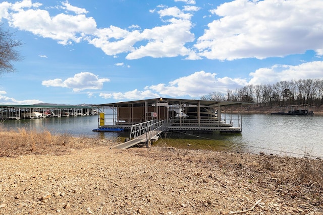 dock area featuring a water view and boat lift