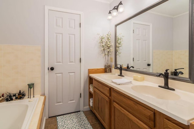 bathroom with tile patterned flooring, double vanity, tiled tub, and a sink