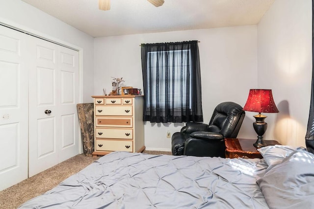 carpeted bedroom with a ceiling fan