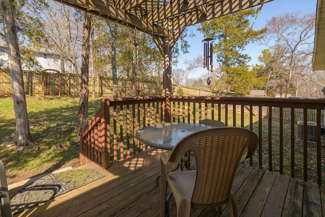 wooden terrace with a pergola and fence