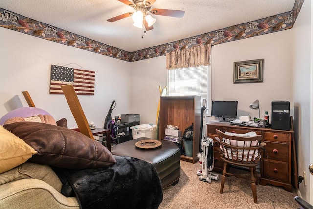 carpeted office with a ceiling fan and a textured ceiling