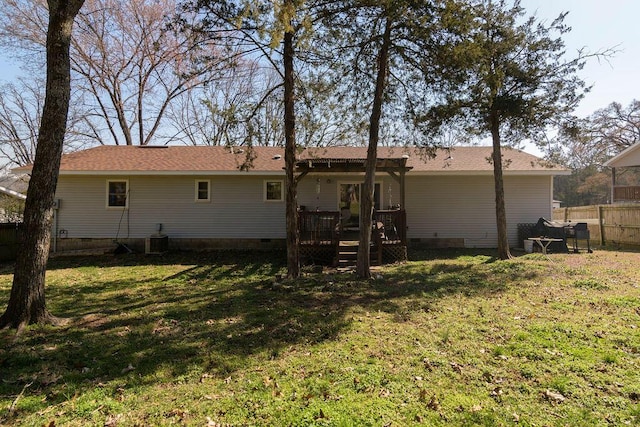 rear view of property featuring crawl space, central air condition unit, a deck, and fence