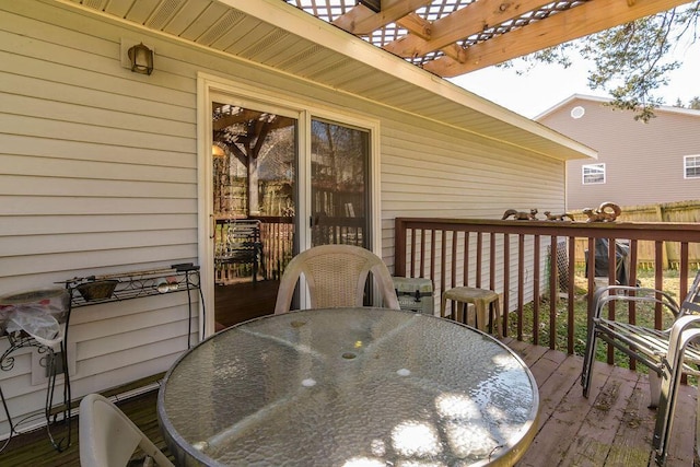 deck with outdoor dining area and a pergola