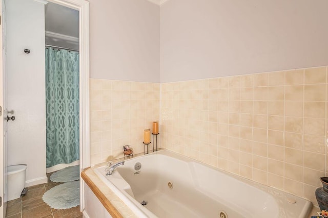 full bathroom with tile patterned floors and a jetted tub