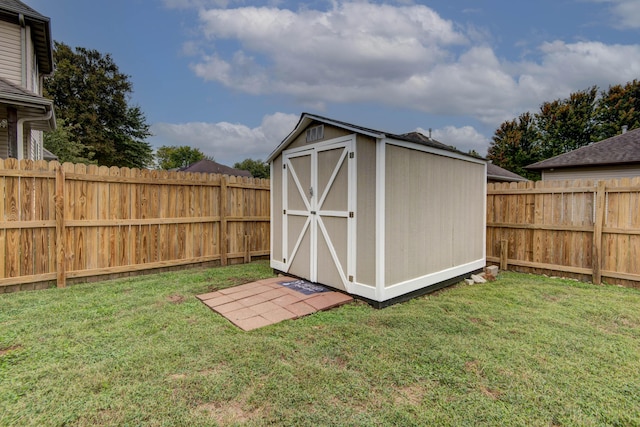 view of shed featuring a fenced backyard