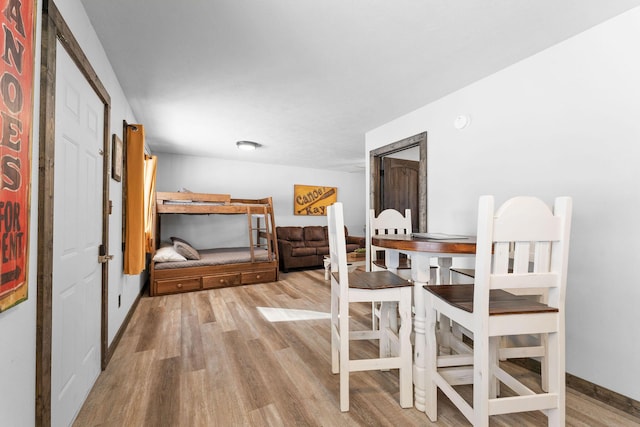 dining space featuring wood finished floors