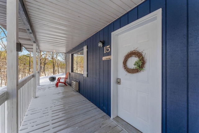 wooden terrace featuring a porch