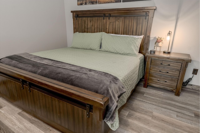 bedroom featuring light wood-type flooring