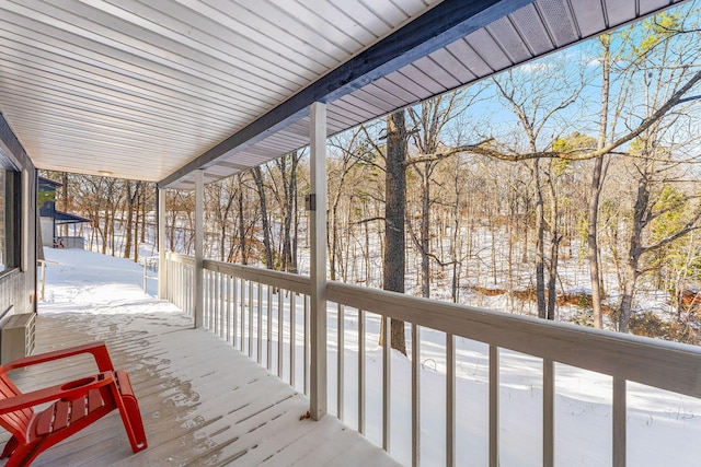 view of snow covered deck