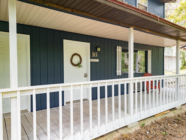 view of exterior entry featuring a porch