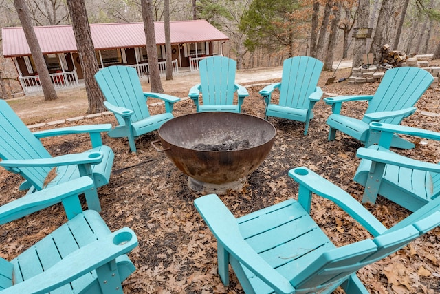 view of patio with a fire pit