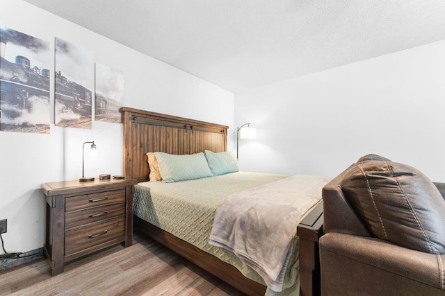 bedroom with light wood finished floors