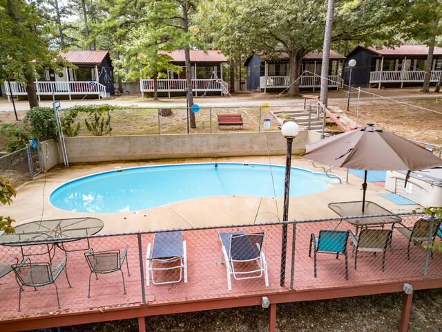 view of pool featuring fence and a fenced in pool