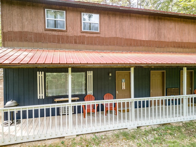 view of front of property with a porch and metal roof