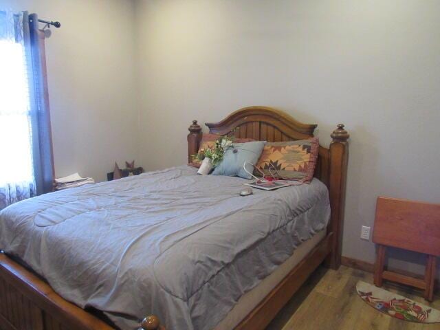 bedroom featuring wood finished floors