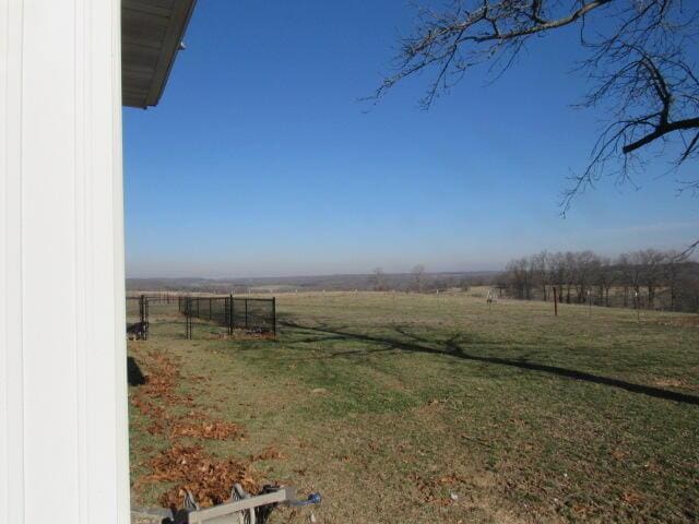 view of yard with a rural view