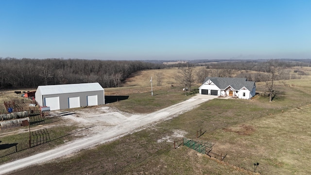 birds eye view of property with a rural view