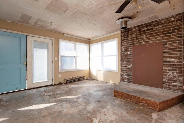 unfurnished sunroom featuring ceiling fan