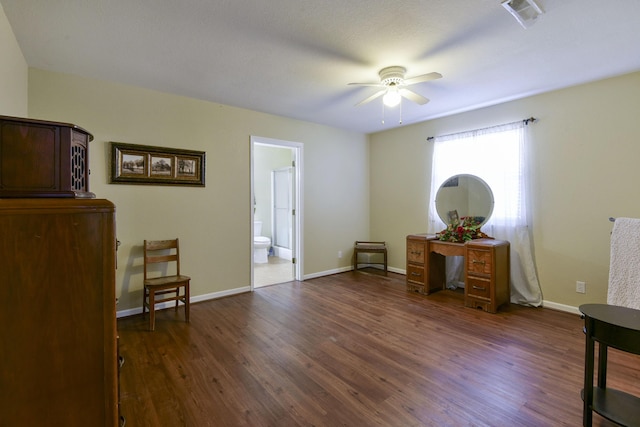 sitting room with visible vents, baseboards, a ceiling fan, and dark wood-style flooring