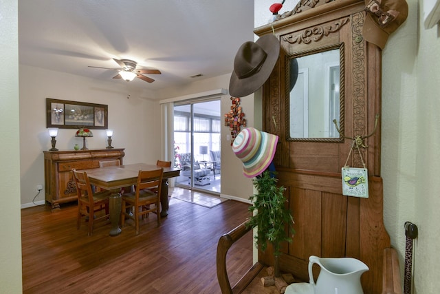 dining space with ceiling fan, visible vents, baseboards, and wood finished floors