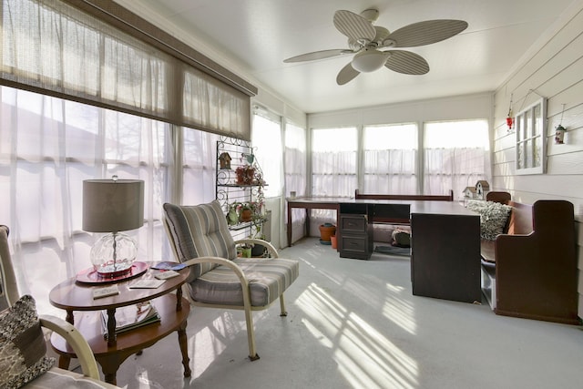 sunroom featuring plenty of natural light and a ceiling fan