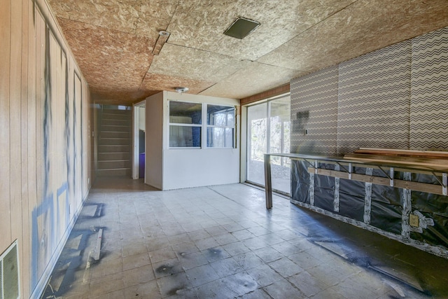 unfurnished sunroom with visible vents