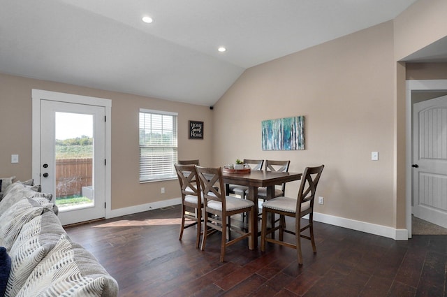 dining room with baseboards, lofted ceiling, and dark wood finished floors