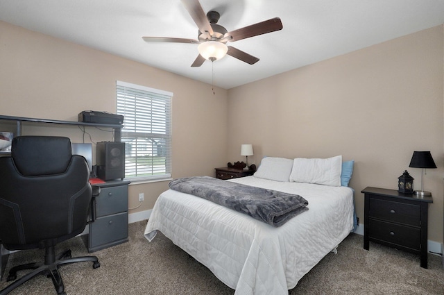 carpeted bedroom featuring baseboards and a ceiling fan