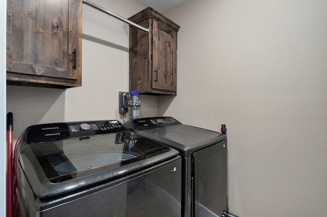 laundry area featuring cabinet space and independent washer and dryer