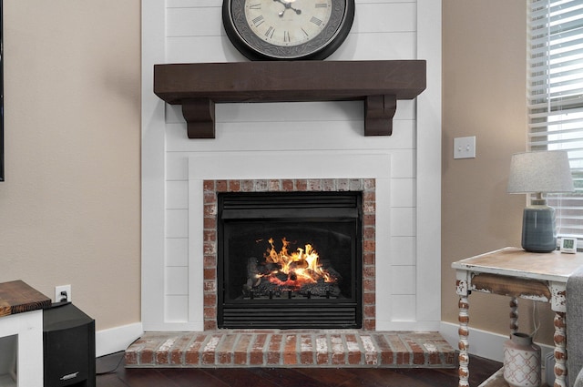 interior details featuring a fireplace and baseboards