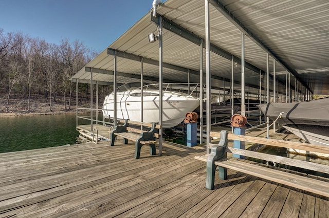 view of dock featuring boat lift and a water view