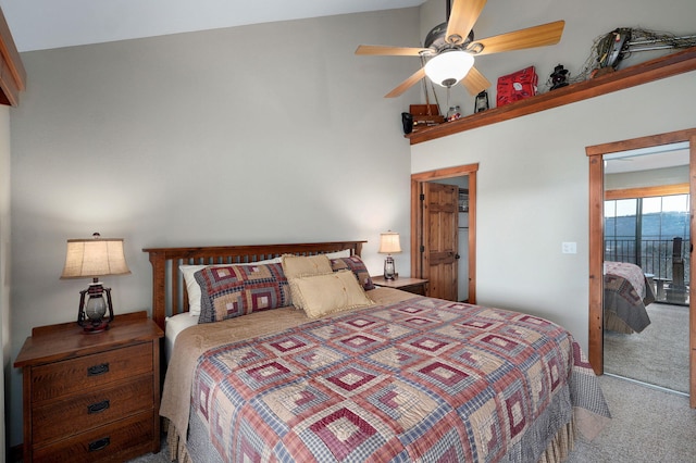 carpeted bedroom with access to outside, a ceiling fan, and a closet