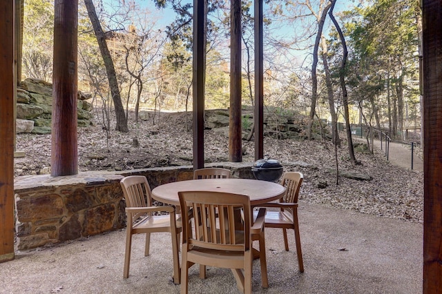 view of patio / terrace featuring outdoor dining area and fence